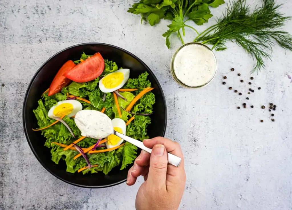 dill picikle ranch dressing on a spoon