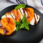 classic keto Caprese Salad on a black plate