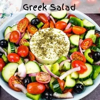 greek salad with feta in a serving dish