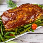 keto turkey meatloaf on a platter with green beans