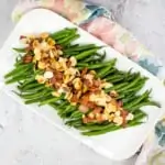 Green Beans Almondine with Bacon on a white plate