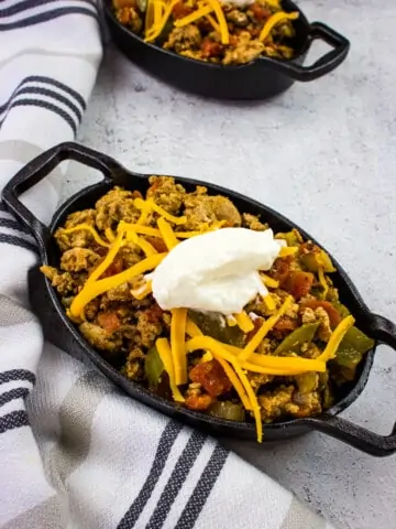 keto turkey chili in black serving dishes