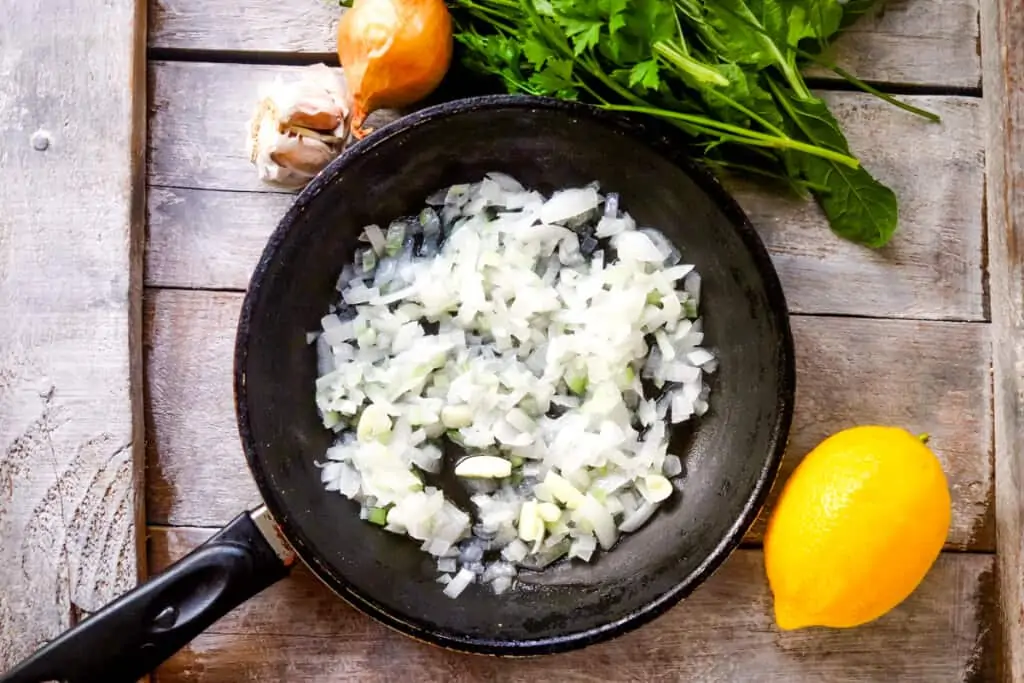 sauteeing onions in a skillet