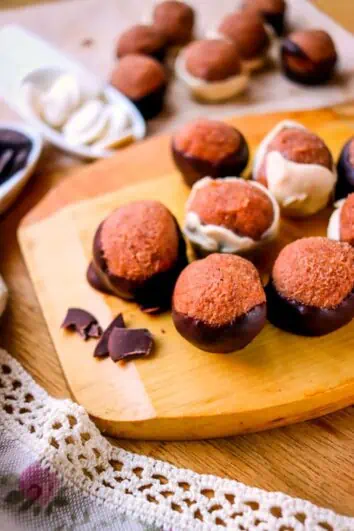 keto peanut butter balls on a wooden platter