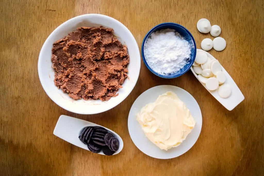 Ingredients to make keto peanut butter balls with chocolate.