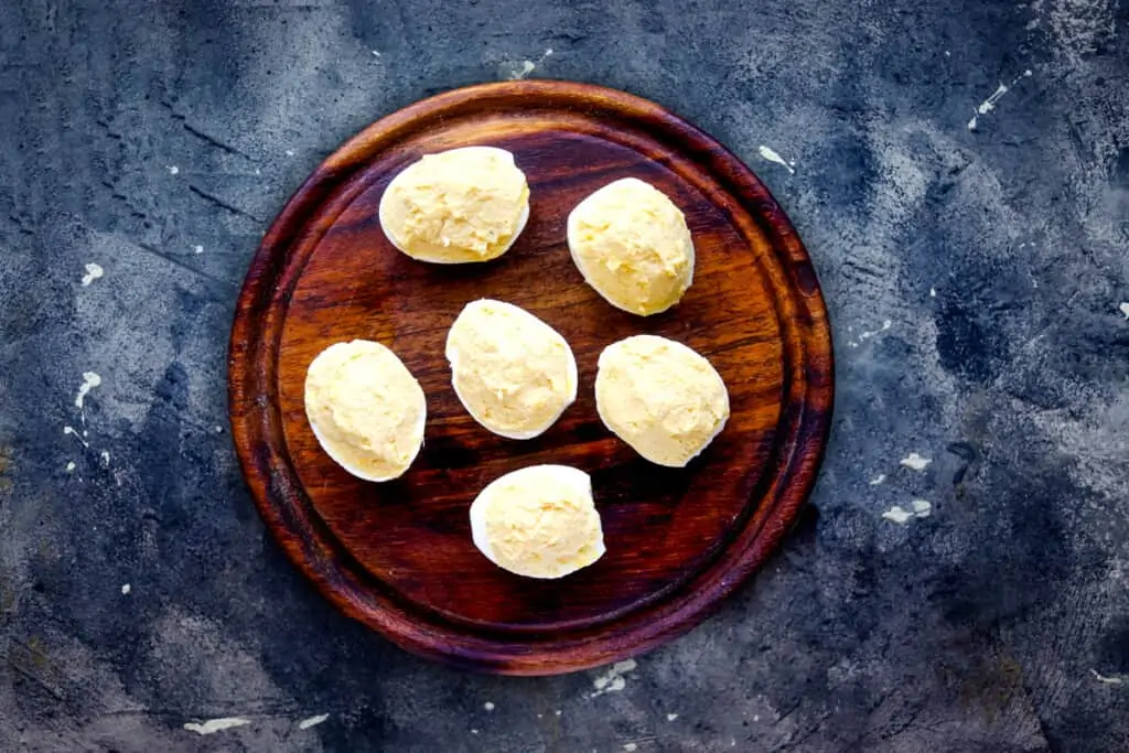 Fill the egg whites with the yolk mixture.