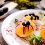 keto spider deviled eggs on a plate