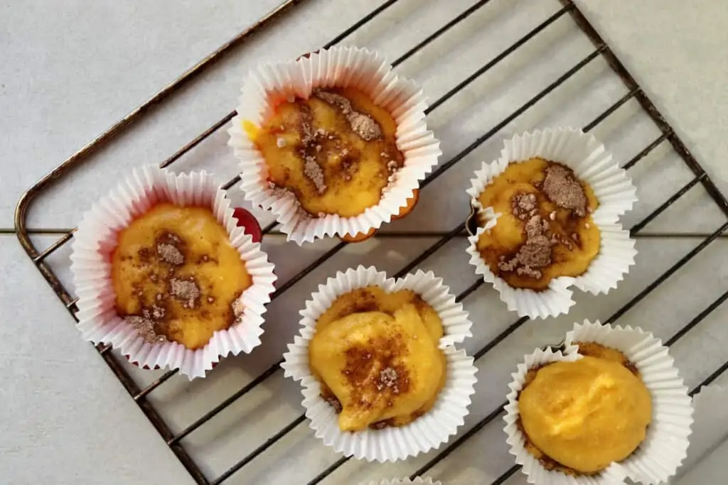 filling muffin cups to make keto cinnamon muffins