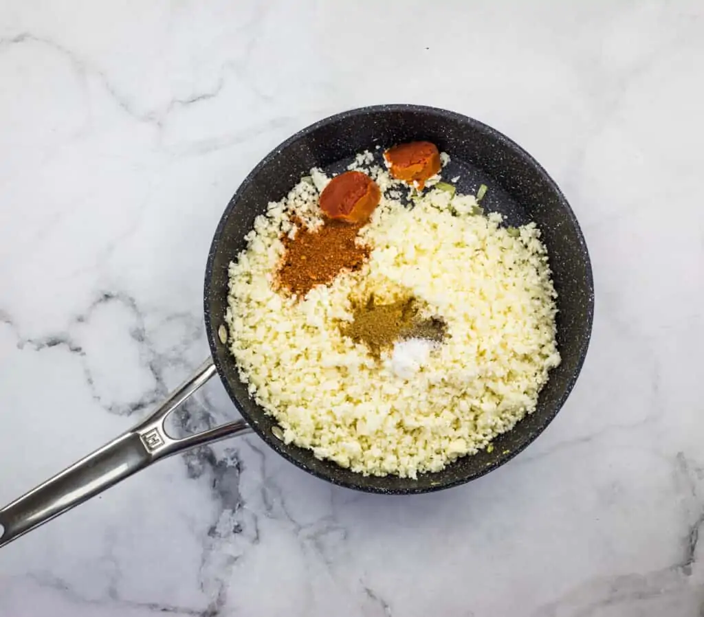 remaining ingredients in the pan to make keto mexican cauliflower rice