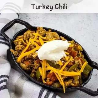 turkey chili in a black serving dish.