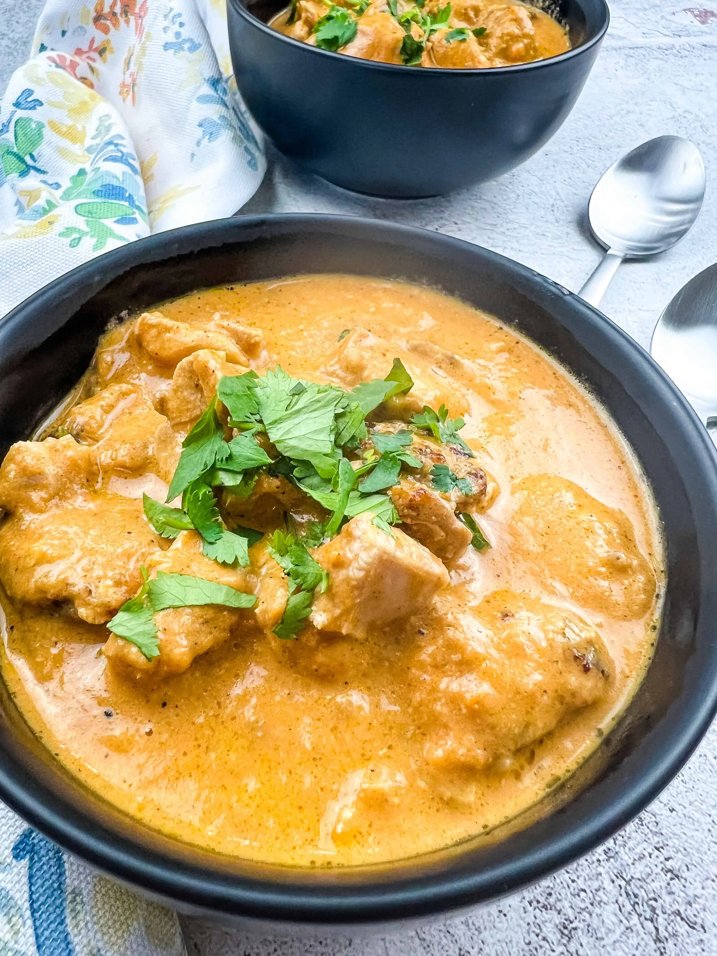 keto chicken tikka masala in a black serving bowl