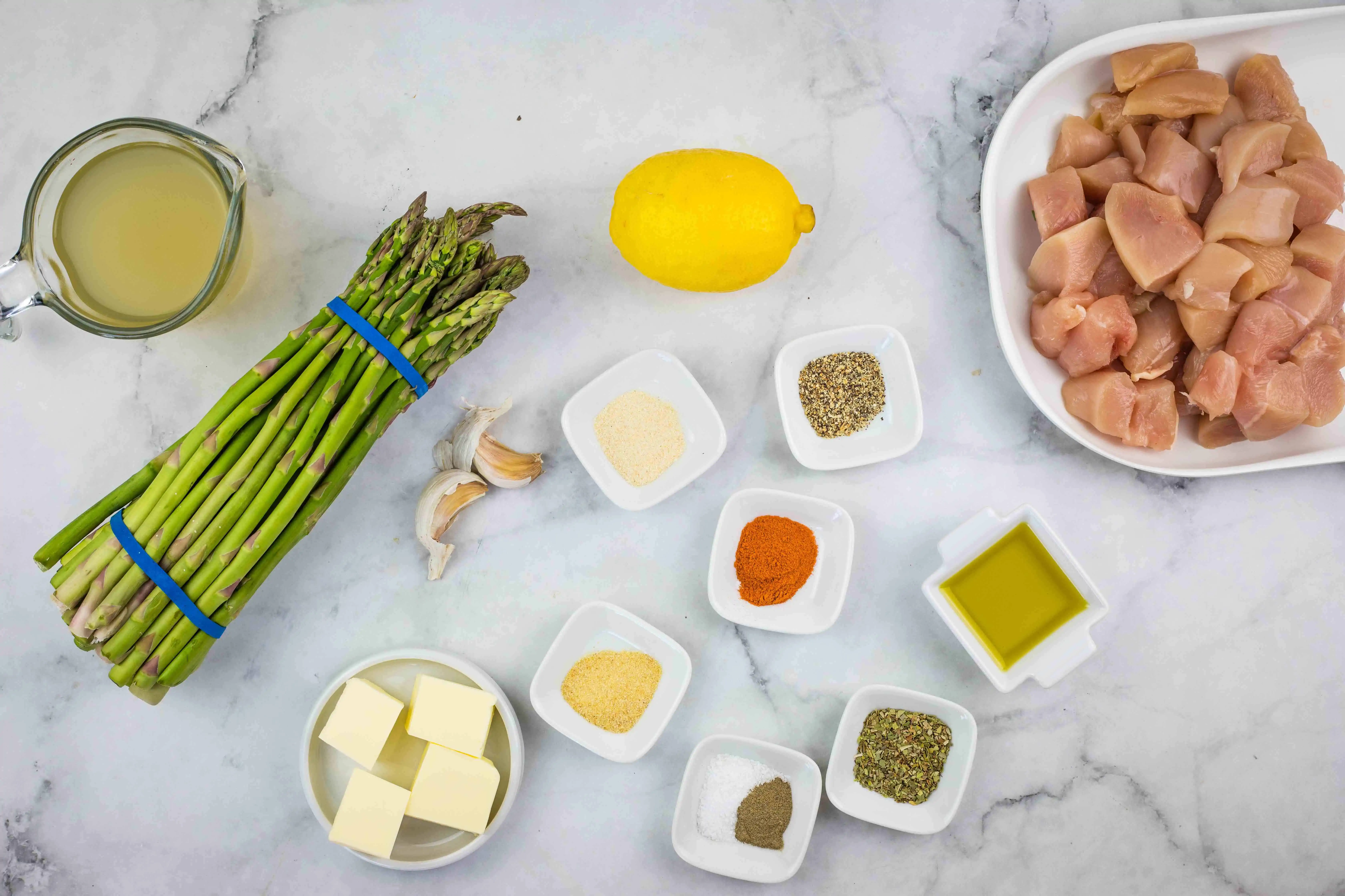ingredients to make keto garlic butter chicken bites with lemon asparagus