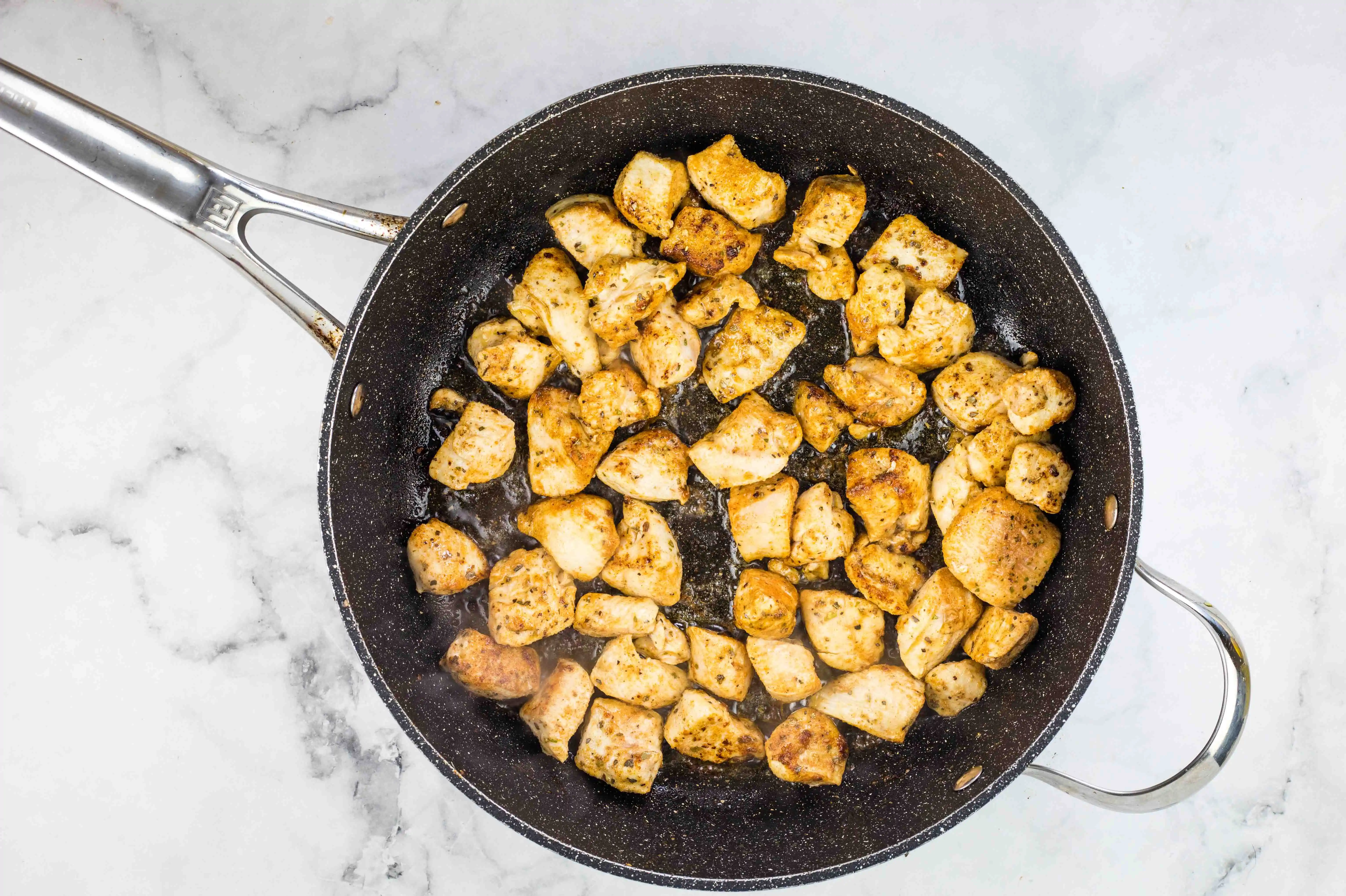 chicken chunks in a skillet
