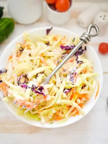 keto coleslaw in a bowl with a fork