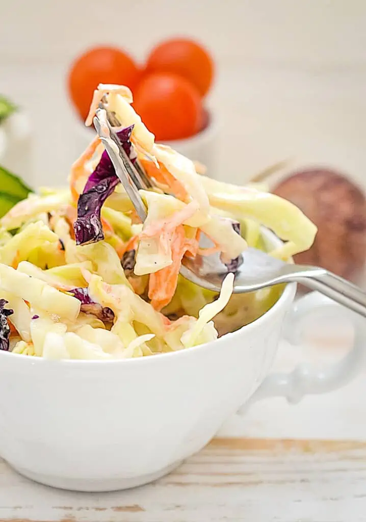 keto coleslaw in a bowl with a fork