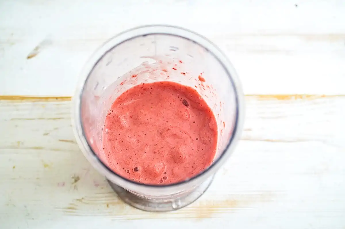 pureed berries and yogurt in the blender cup