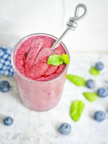 keto blueberry smoothies in a glass in a glass