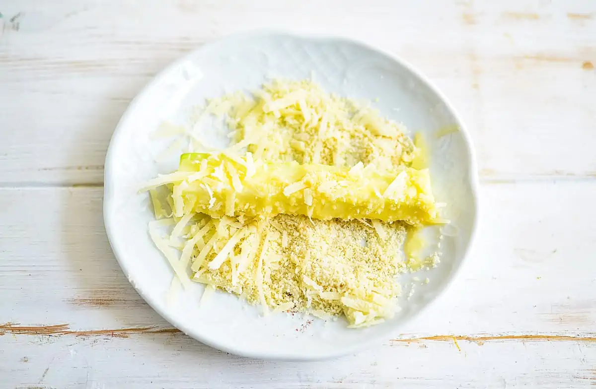 Egg dipped zucchini now coated in almond flour and cheese mixture.