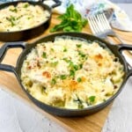 keto chicken and zucchini casserole in two baking dishes.