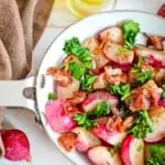 Sauteed radishes in a skillet.