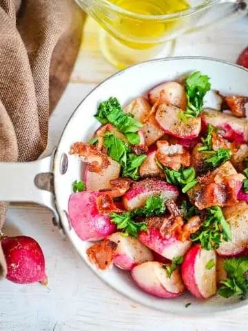 Sauteed radishes in a skillet.