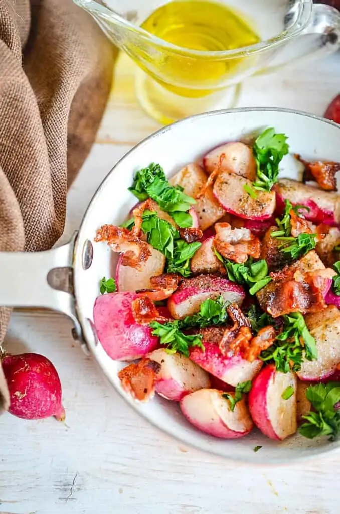 Sauteed radishes in a skillet.