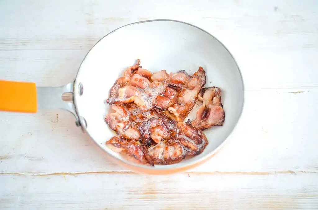 Crispy bacon in a skillet.