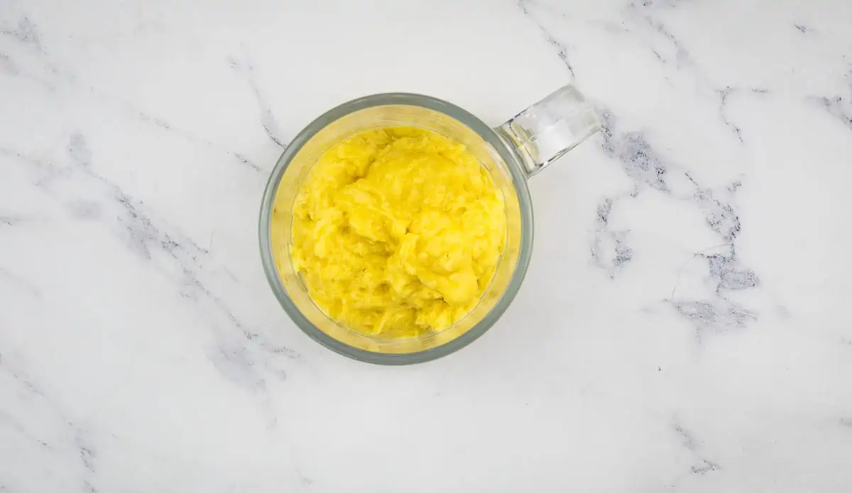 Batter in a glass mug ready for cooking.