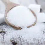 erythritol in a spoon and in cubes.