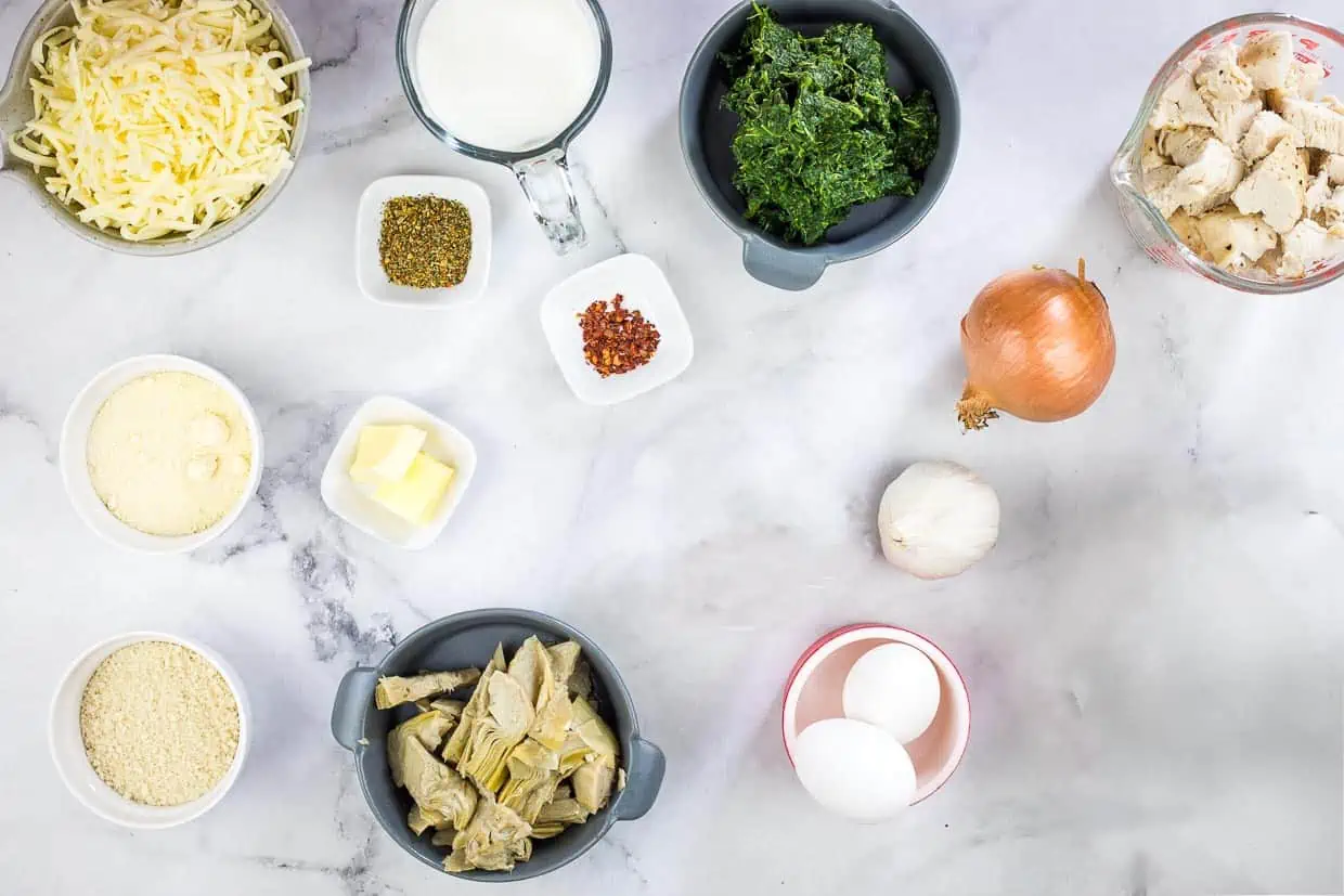 Ingredients to make keto chicken florentine bake with artichoke hearts.