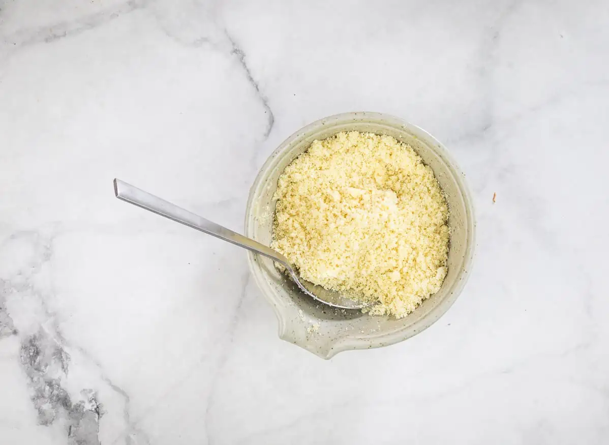 Parmesan, pork panko and butter mixed in a bowl.