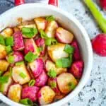 Roasted radishes in a round bowl.