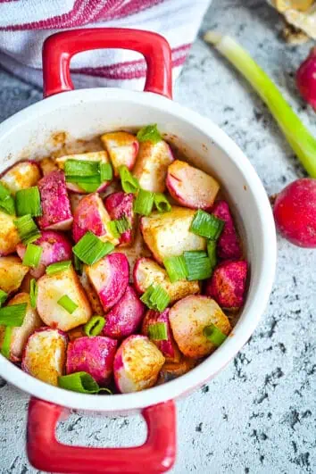 Roasted radishes in a round bowl.