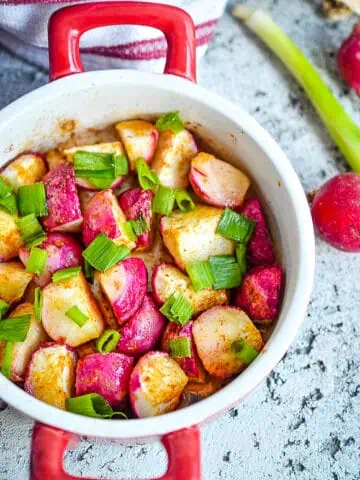 Roasted radishes in a round bowl.