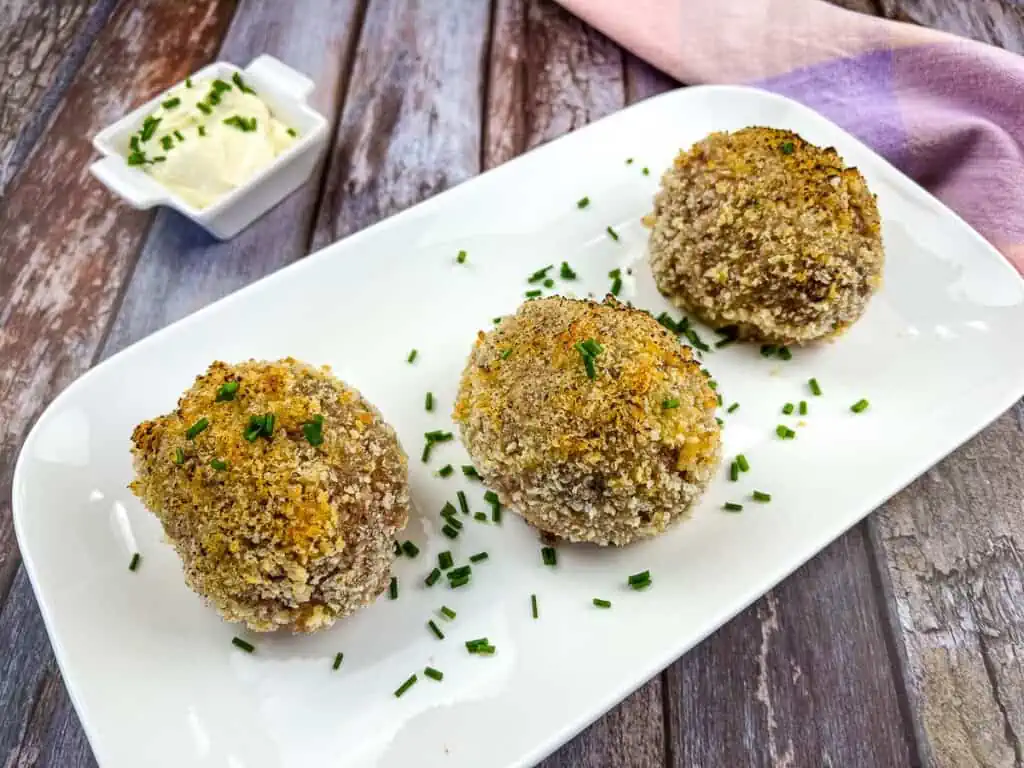 Keto scotch eggs on a plate.