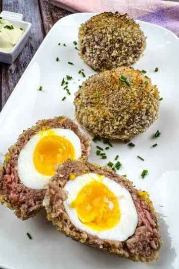 Keto Scotch Eggs on a white plate.