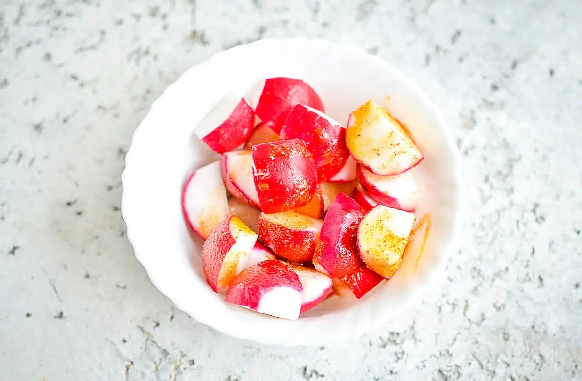 Radishes tossed with oil.