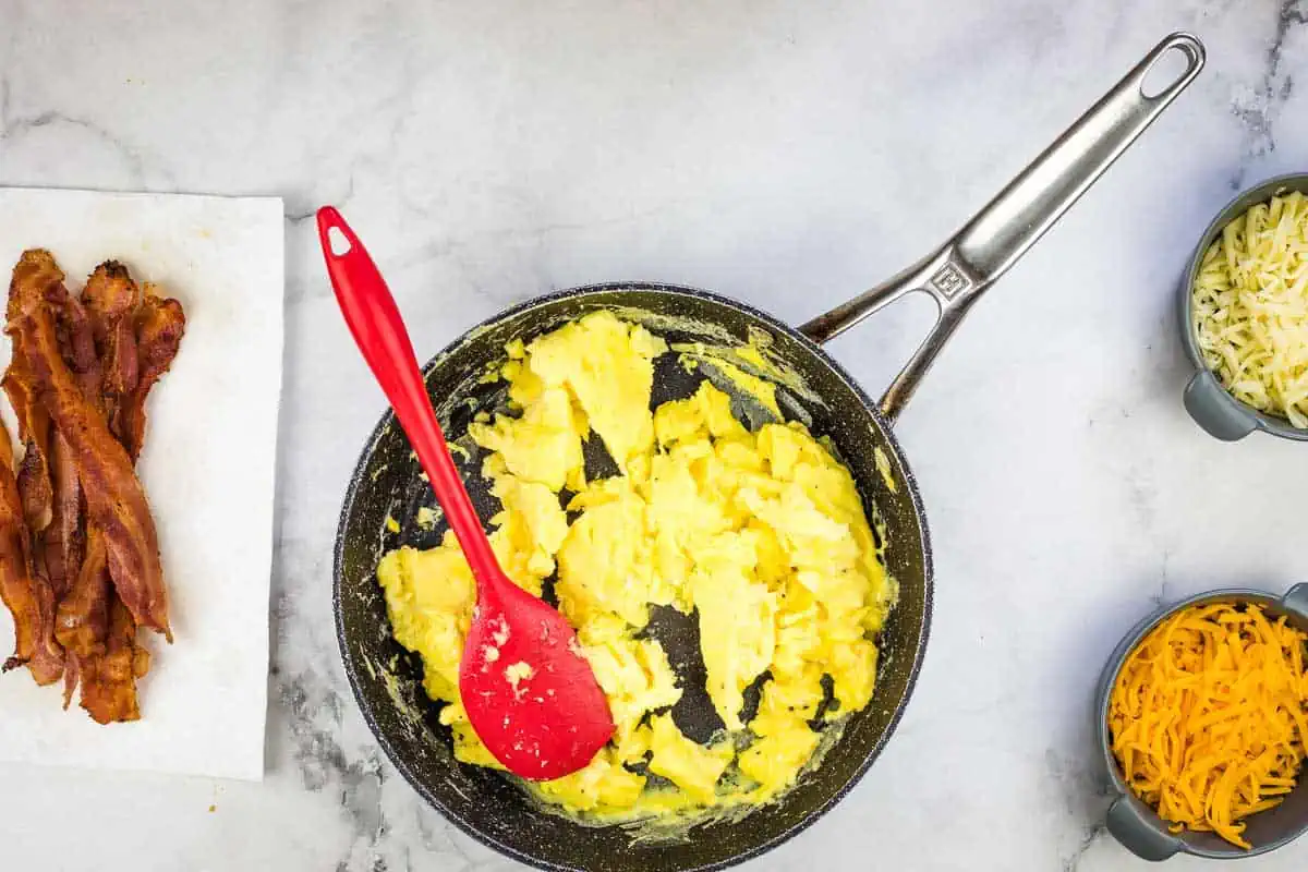 Scrambled eggs in a skillet.