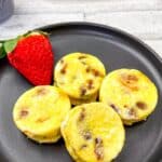 Egg bites on a black plate.