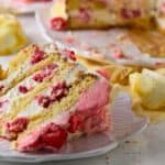 Delicious keto-friendly raspberry lemon cake with whipped cream, perfect for low-carb desserts.