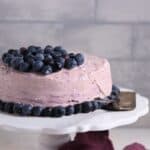 A beautifully decorated blueberry keto cake featuring a light frosting, fresh blueberries, and a low-carb, sugar-free recipe suitable for ketogenic diets.
