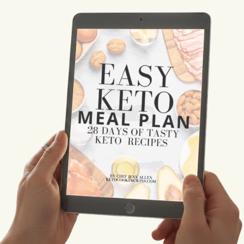 Someone holding a tablet with an Keto eBook displayed.