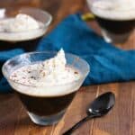 Three glasses of keto coffee jelly on a wooden surface.
