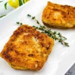 A close-up shot of Keto Fried Cod on a white plate.