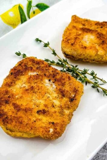 A close-up shot of Keto Fried Cod on a white plate.