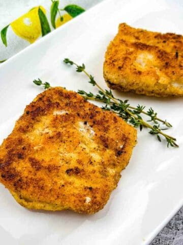 A close-up shot of Keto Fried Cod on a white plate.
