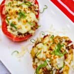 Two pieces of Keto Italian Peppers on a white plate.