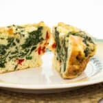 Spinach, Feta, and Red Pepper Egg Cup on a plate.